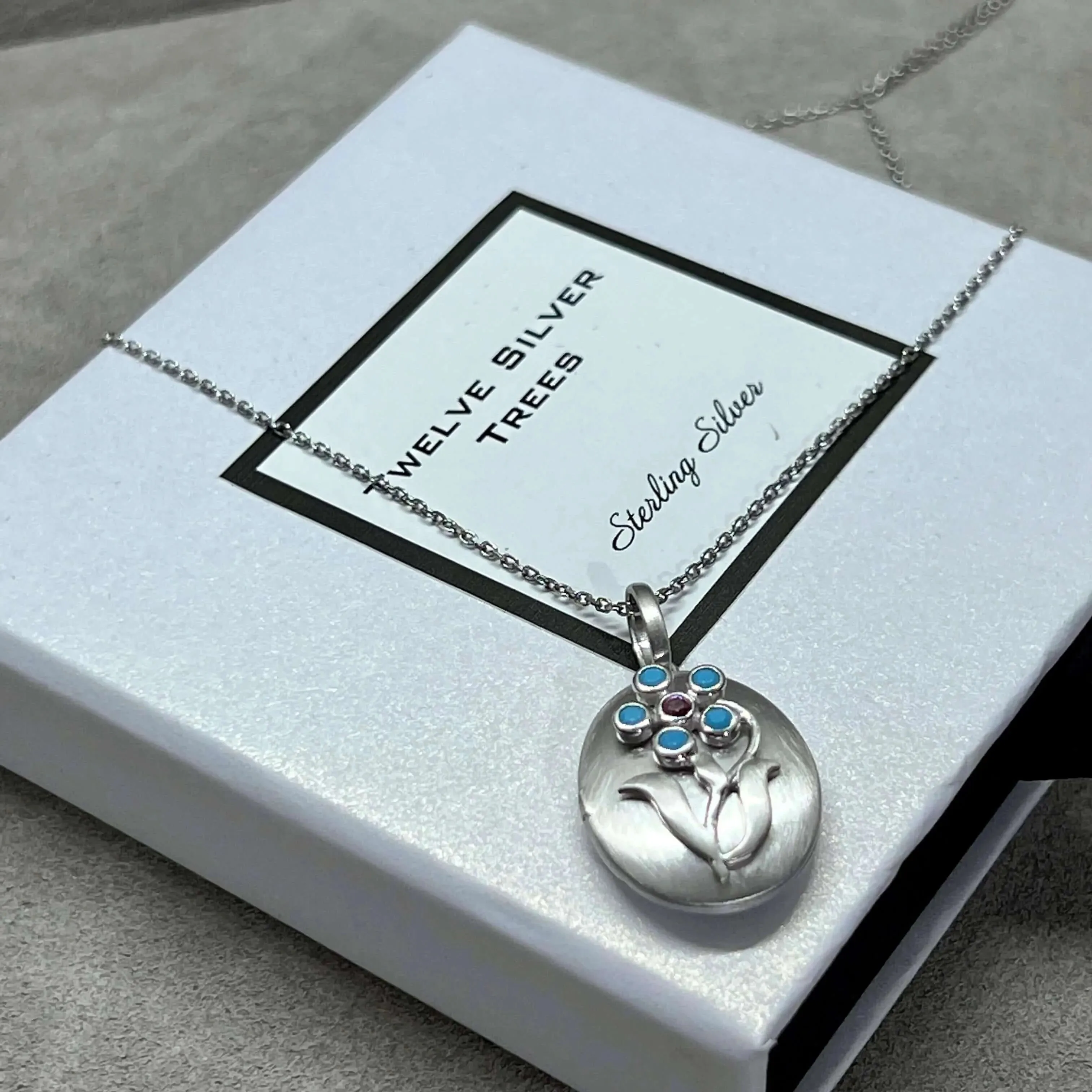 Arts & Crafts Style Forget Me Not Flower Locket With Turquoise in Sterling Silver