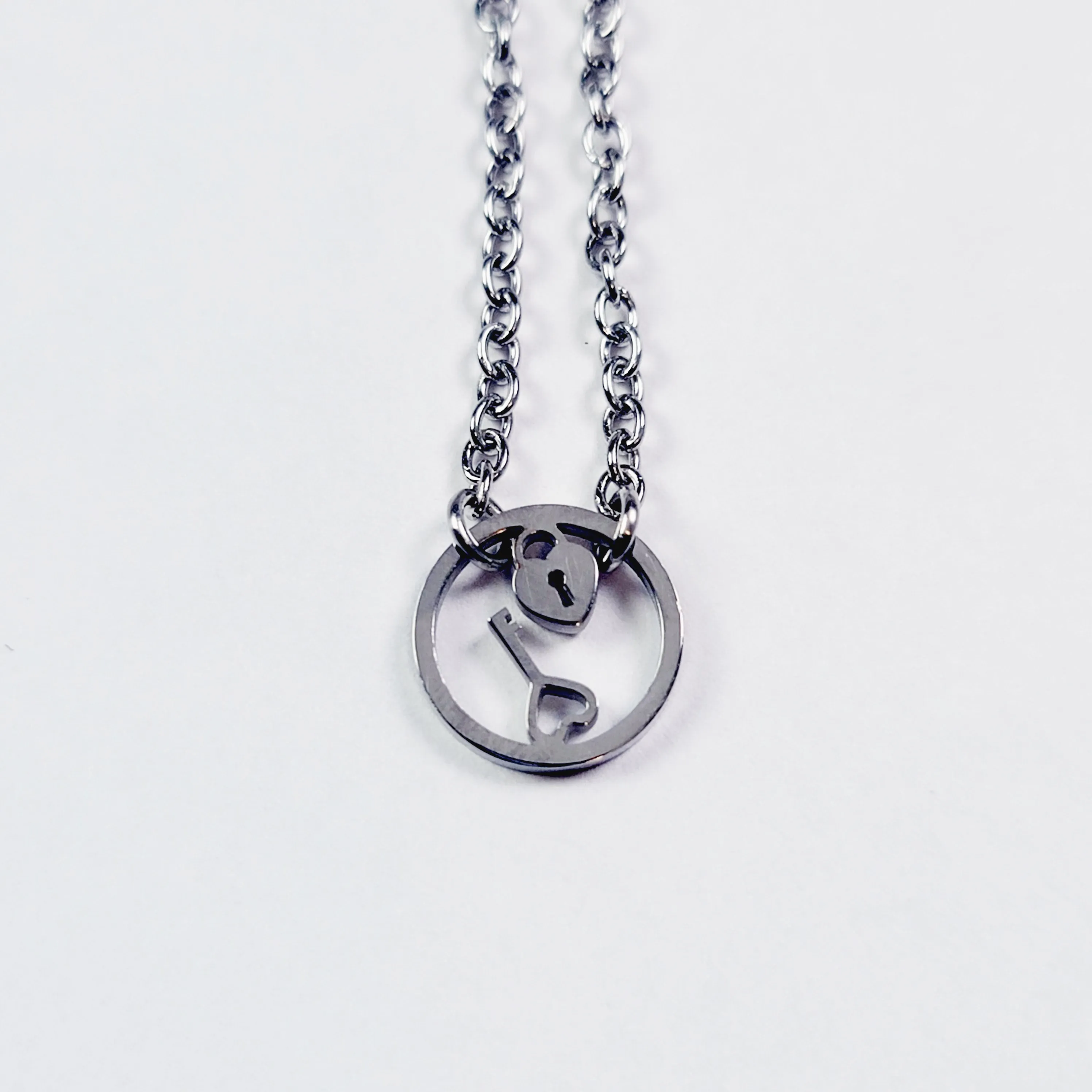 Day Collar, Stainless Steel with Circle of O Heart Locket and Key Pendant. 24/7 Wear Discreet Collar