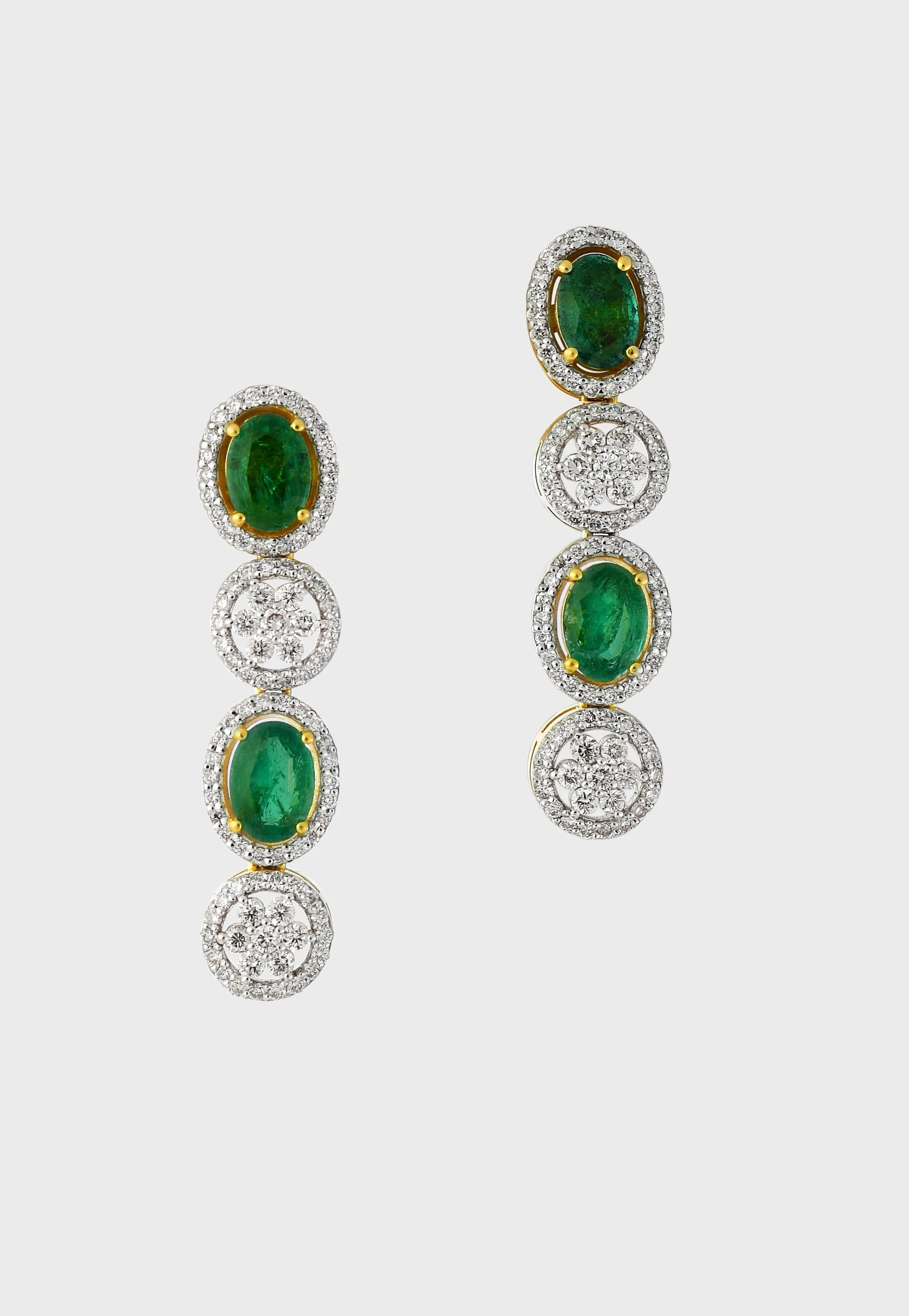 Enchant with elegance in our Emerald oval and diamond necklace and earring pair. Each piece exudes timeless sophistication and luxury.(GDNE0470)