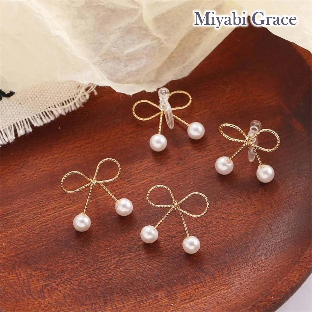 Gold Ribbon White Pearl Tie Invisible Clip On Stud Earrings