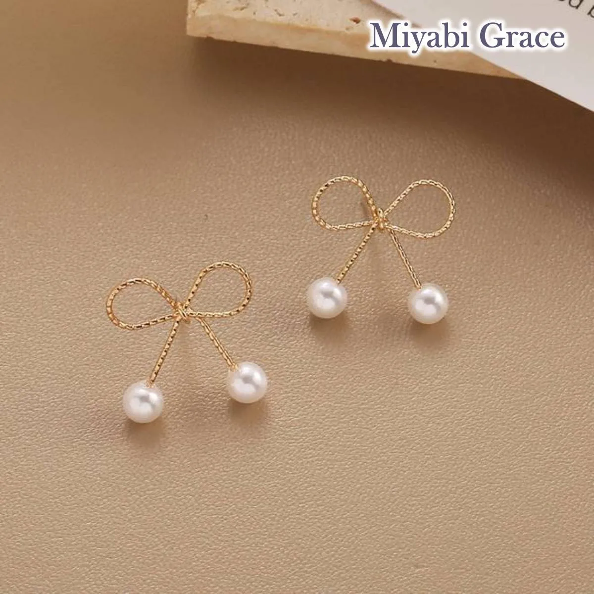 Gold Ribbon White Pearl Tie Invisible Clip On Stud Earrings