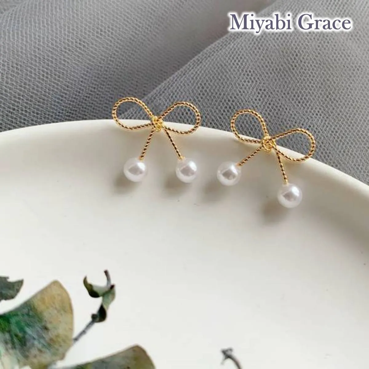 Gold Ribbon White Pearl Tie Invisible Clip On Stud Earrings